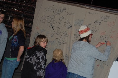 Signing the prayer wall